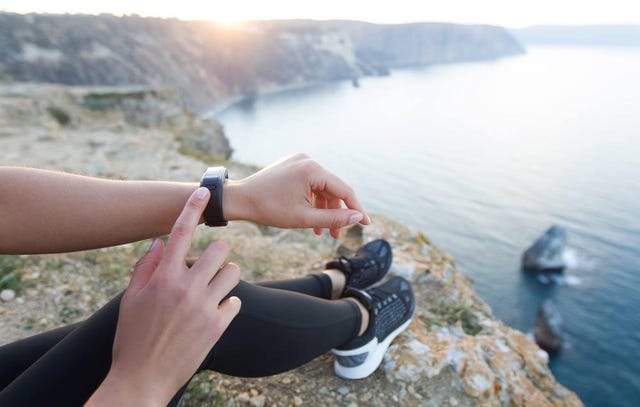 woman with tracker in pretty setting