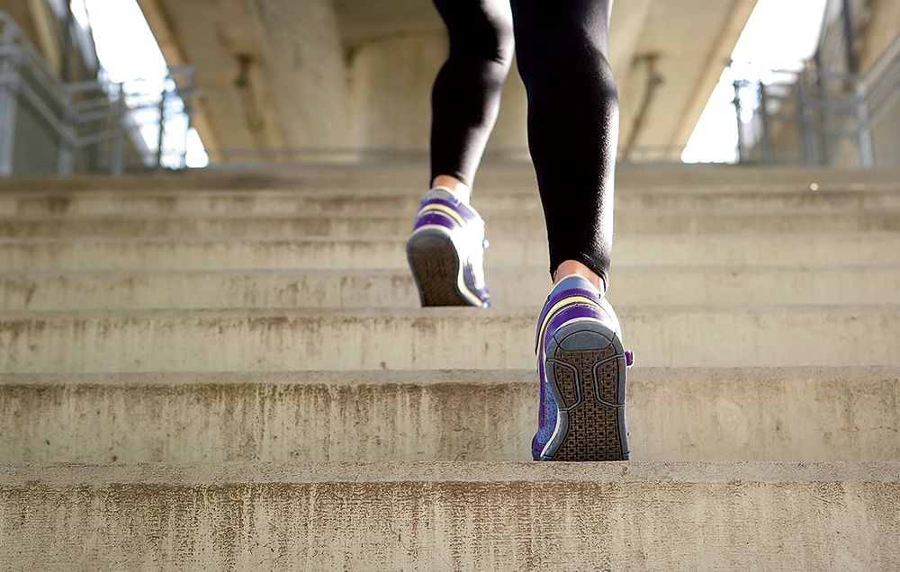woman climbing stairs