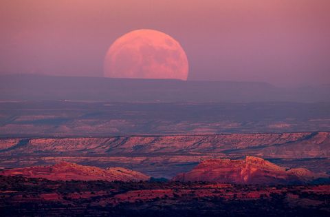 The November 2016 supermoon hangs above the Valley of the Gods near Mexican Hat Utah