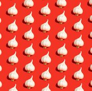 garlic bulbs on red background