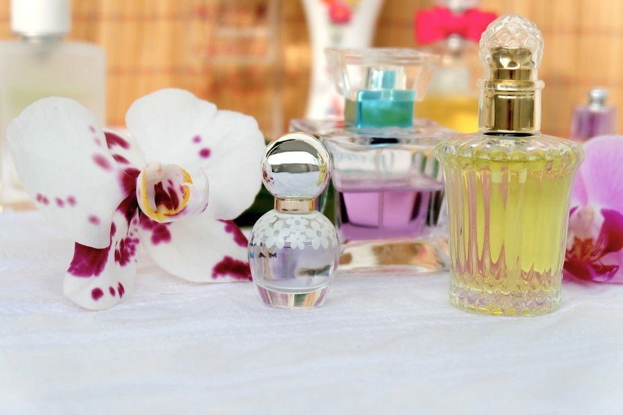 Perfume, Product, Cosmetics, Glass bottle, Beauty, Pink, Material property, Bottle, Flower, Plant, 