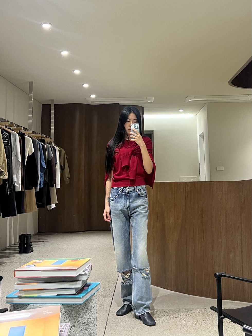 a person standing in a clothing store