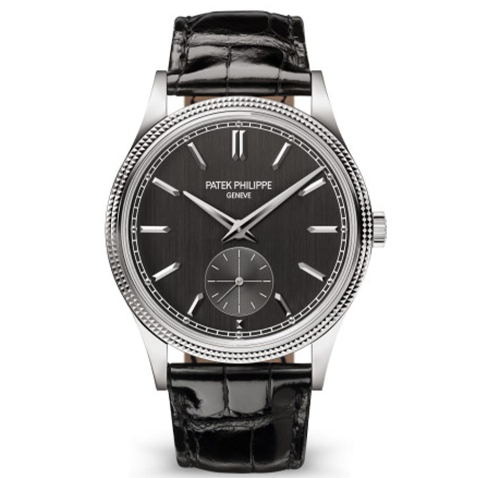 luxury wristwatch with a dark dial and leather strap