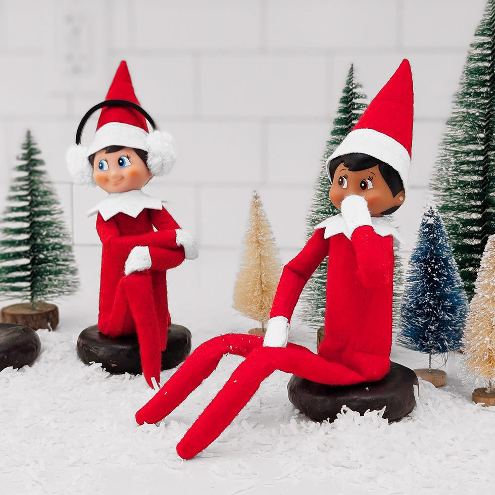 two elves sit on chocolate donuts
