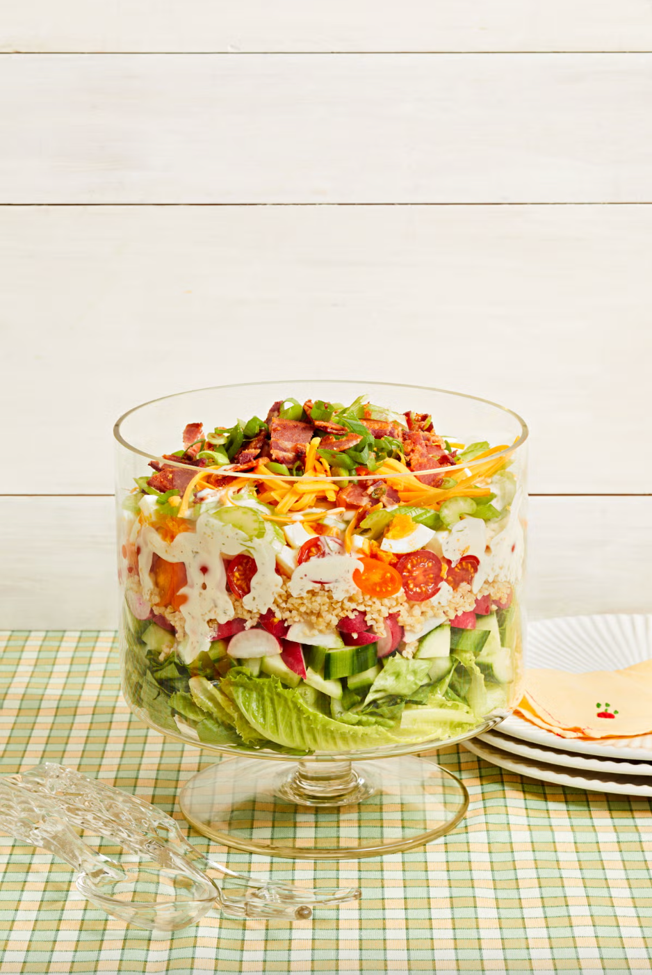 eleven layer salad in a glass trifle dish