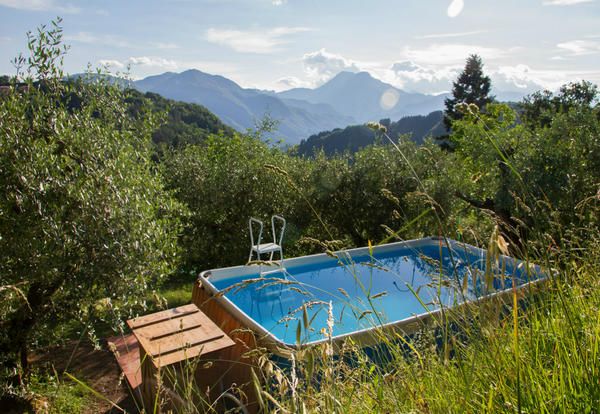 Swimming pool, Natural landscape, Property, Mountain, Nature reserve, Wilderness, Tree, House, Real estate, Mountain range, 