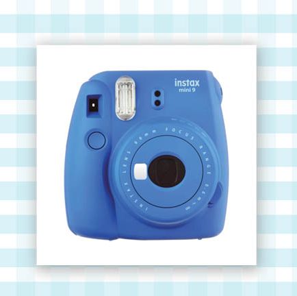 instant print camera in blue and airpods