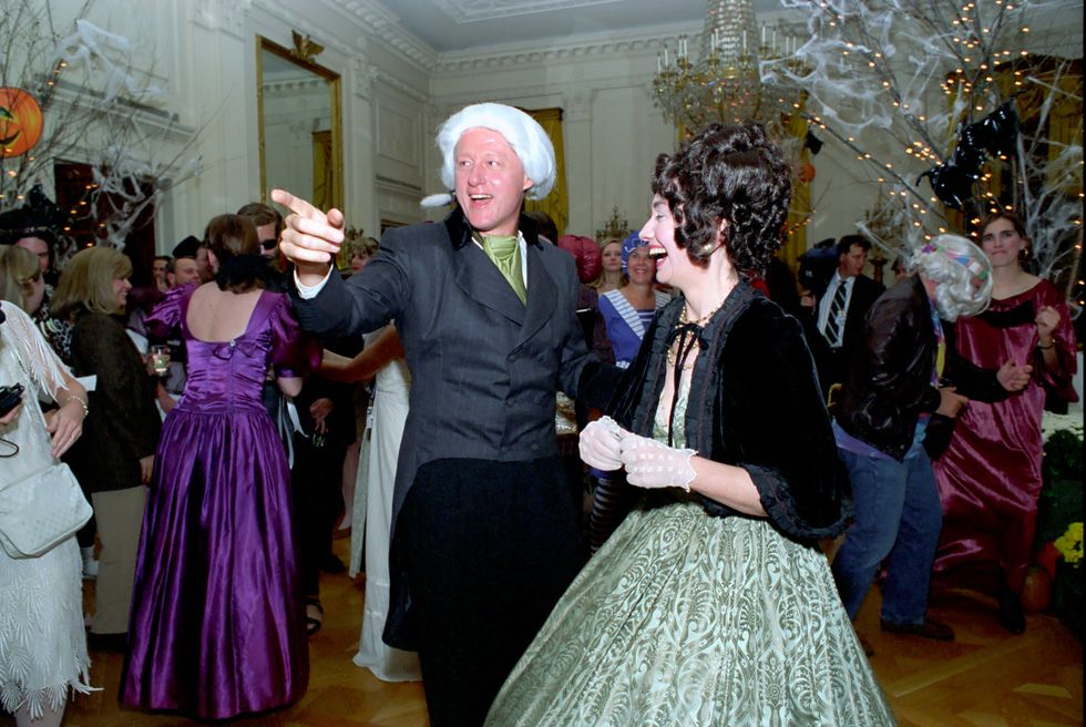 this photograph is of president bill clinton and first lady hillary rodham clinton dressed up as president and first lady james and dolley madison for a halloween party in the east room of the white house