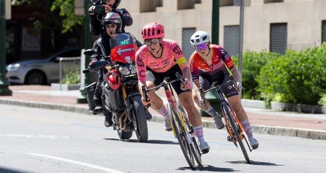 a group of people riding bikes