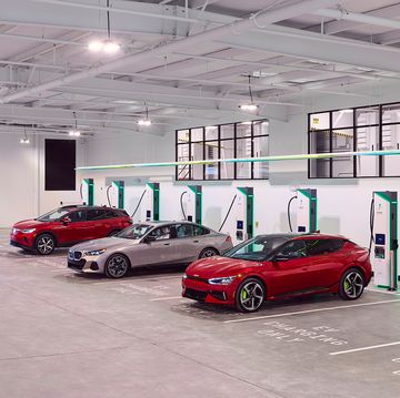a group of evs charging in a large building