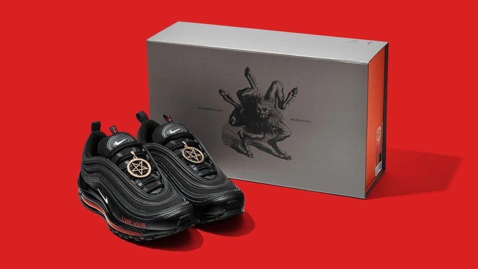 custom black nike air max 97 sneakers with a unique design and themed box