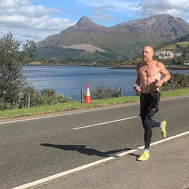 Mountainous landforms, Road, Asphalt, Highland, Road surface, Hill, Mountain range, Shorts, Running, Knee, 
