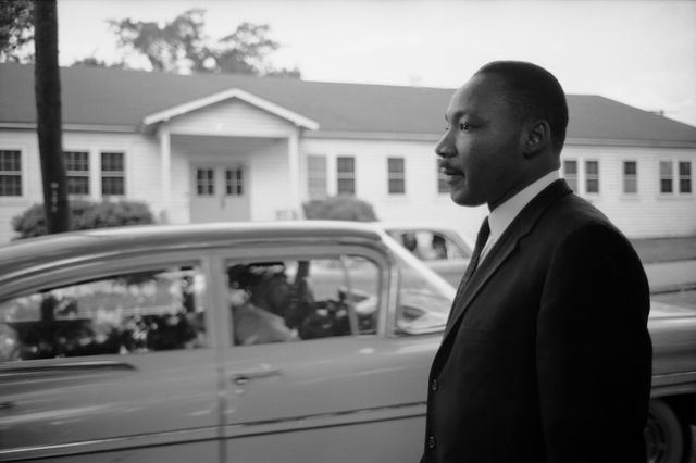 Martin Luther King Jr. as he stands beside a street in Petersburg, Virginia, May 1960
