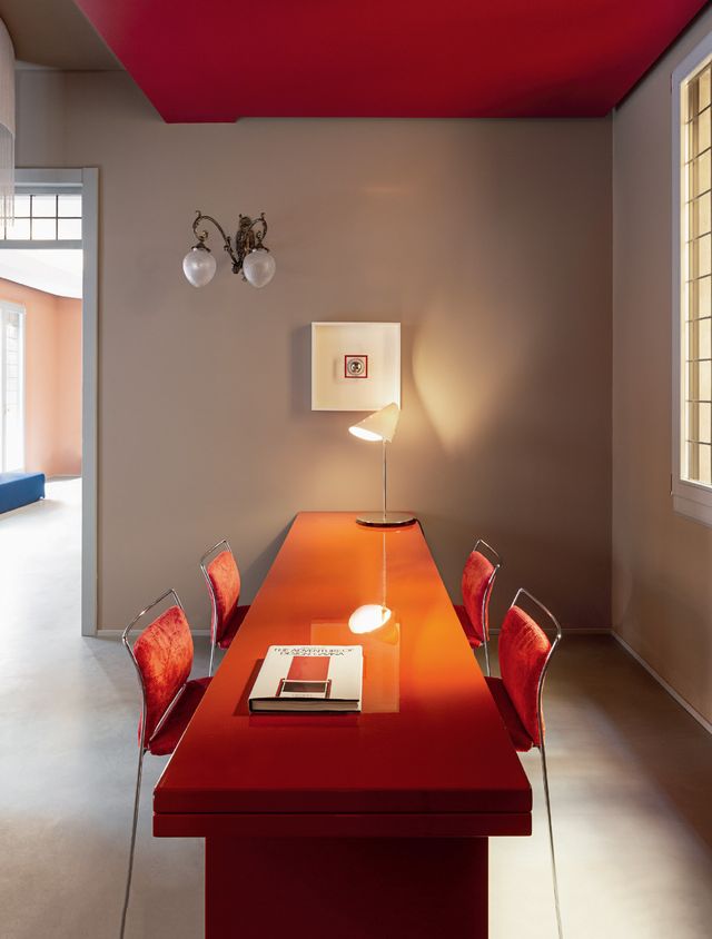 Room, Interior design, Orange, Ceiling, Red, Table, Furniture, Wall, Lighting, Building, 