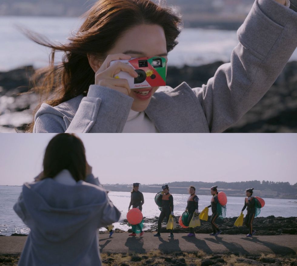 a person taking a picture of a group of people