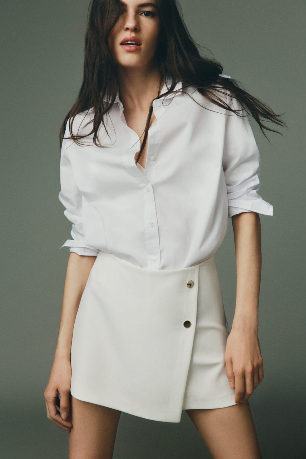 fashionable outfit featuring a white shirt and a white skirt