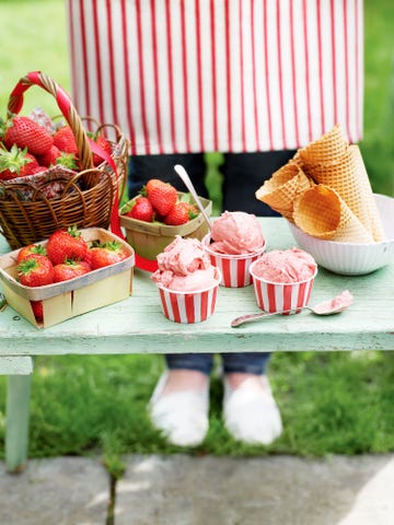 strawberry ice cream in striped pots, basket, cones, summer