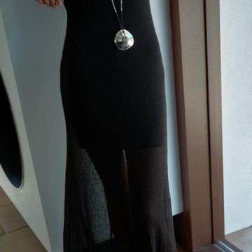 a person wearing a black dress and high heels