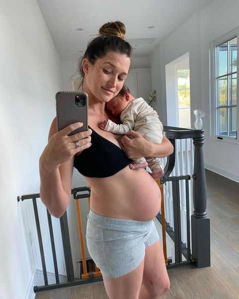 jade tolbert taking a selfie with her newborn baby