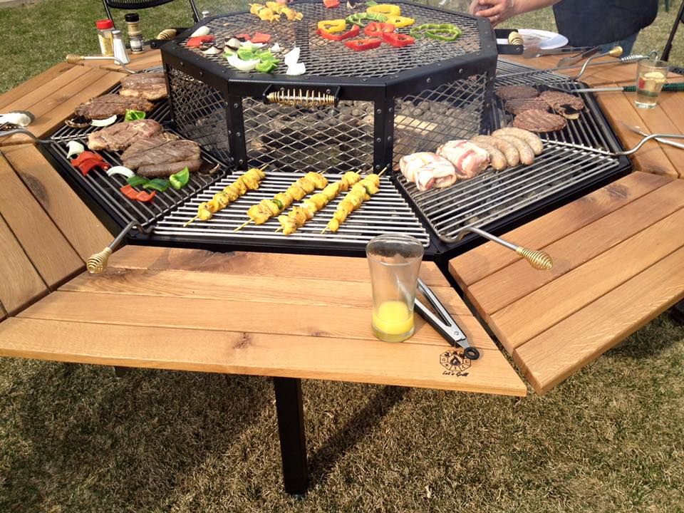 This Tricked-Out Fire Pit Is A Grill And Dining Table In One