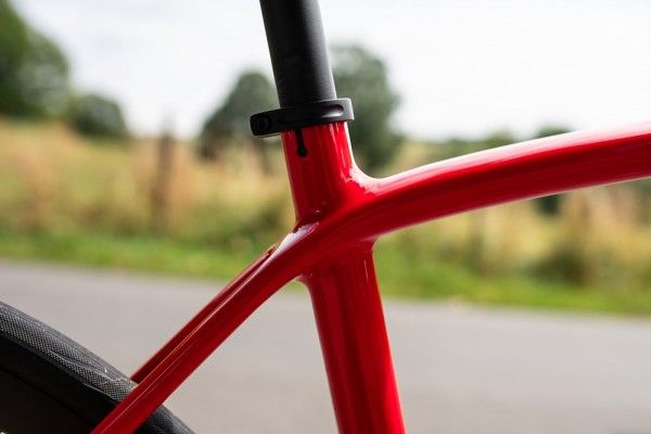 Bicycle part, Bicycle wheel, Red, Bicycle frame, Bicycle, Vehicle, Road bicycle, Bicycle tire, Bicycle handlebar, Rim, 