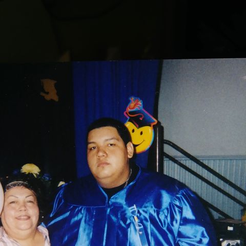 overweight man in graduation gown