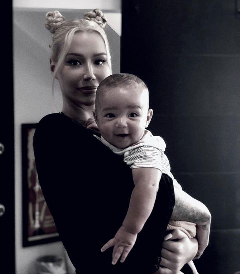 a black and white mirror selfie of iggy azalea and her baby son onyx