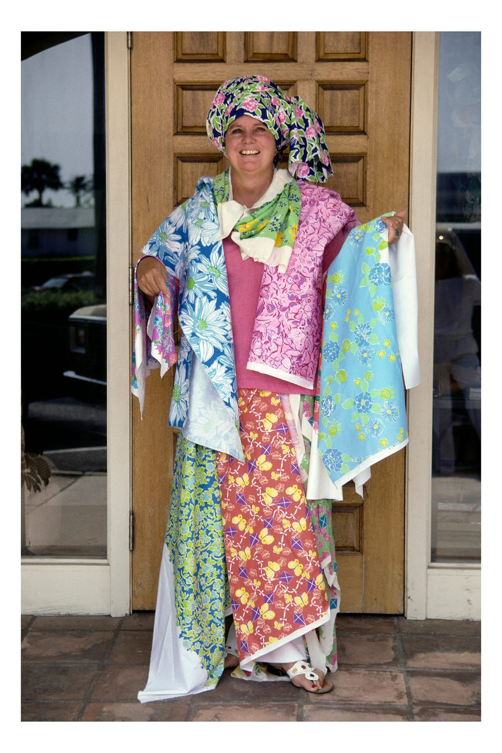 A person exhibiting colorfully patterned fabrics