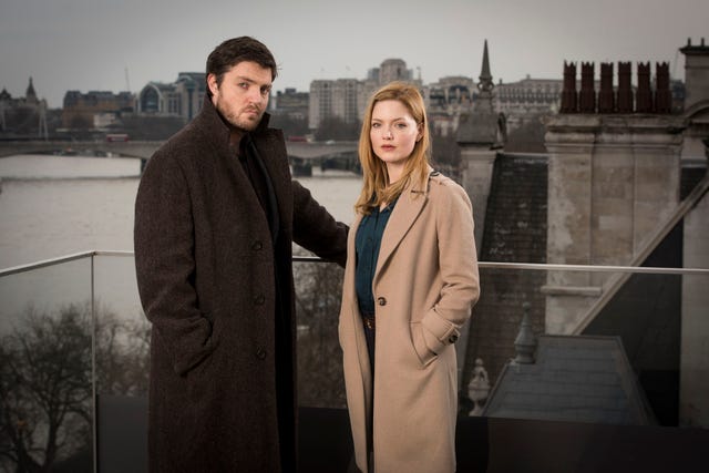 warning: embargoed for publication until 00:00:01 on 22/08/2017 programme name: strike the cuckoos calling tx: n/a episode: n/a (no. n/a) picture shows: cormoran strike (tom burke), robin ellacott (holliday grainger) (c) bronte film  tv ltd photographer: steffan hill