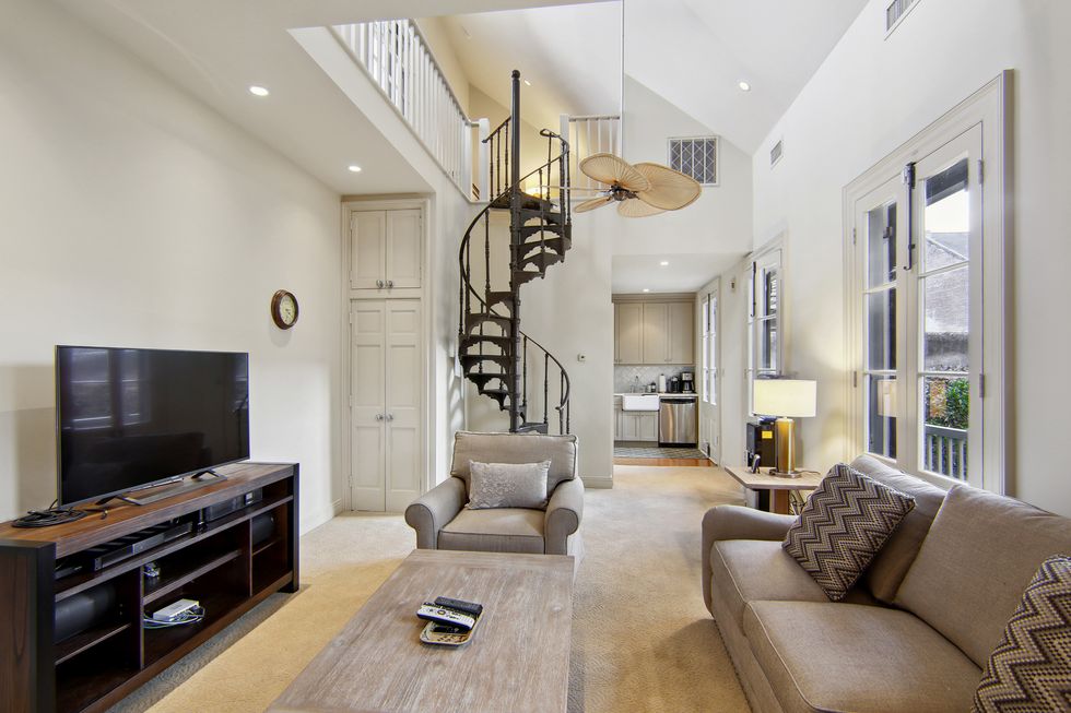 a living room with a staircase