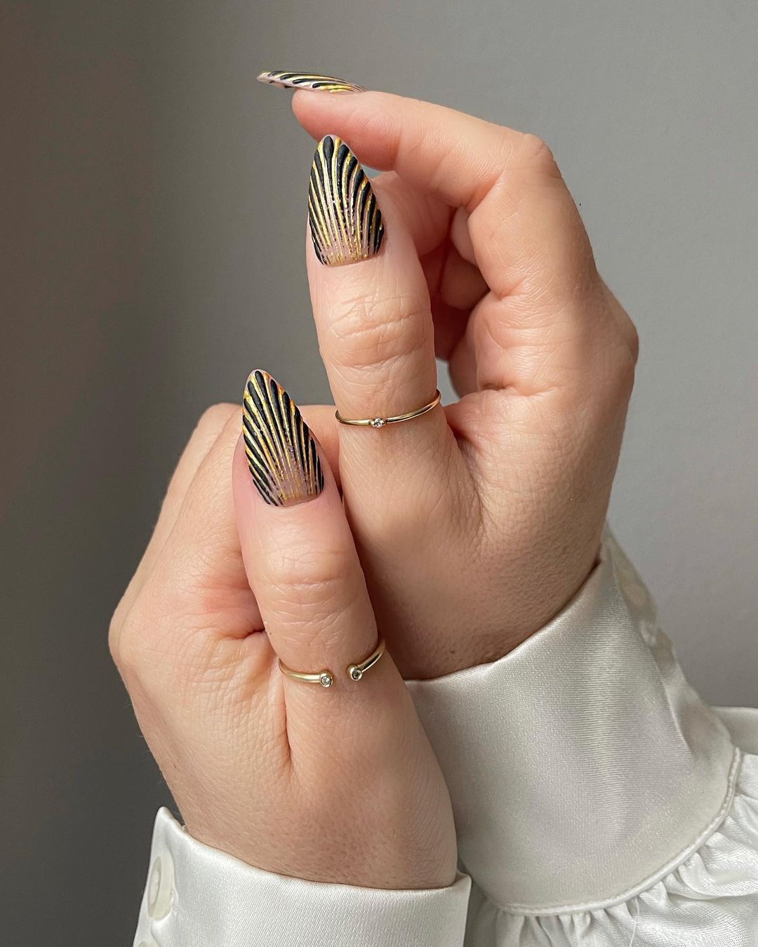 Elegant Nail Art - White and Gold Nail Designs This gold-lined manicure  takes white nail polish to the next level. Using a metallic gold varnish,  you can carefully paint geometric lines across