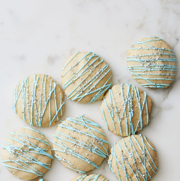 lemon ricotta cookies with blue icing drizzled on top