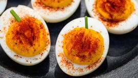 pumpkin deviled eggs with paprika and chives