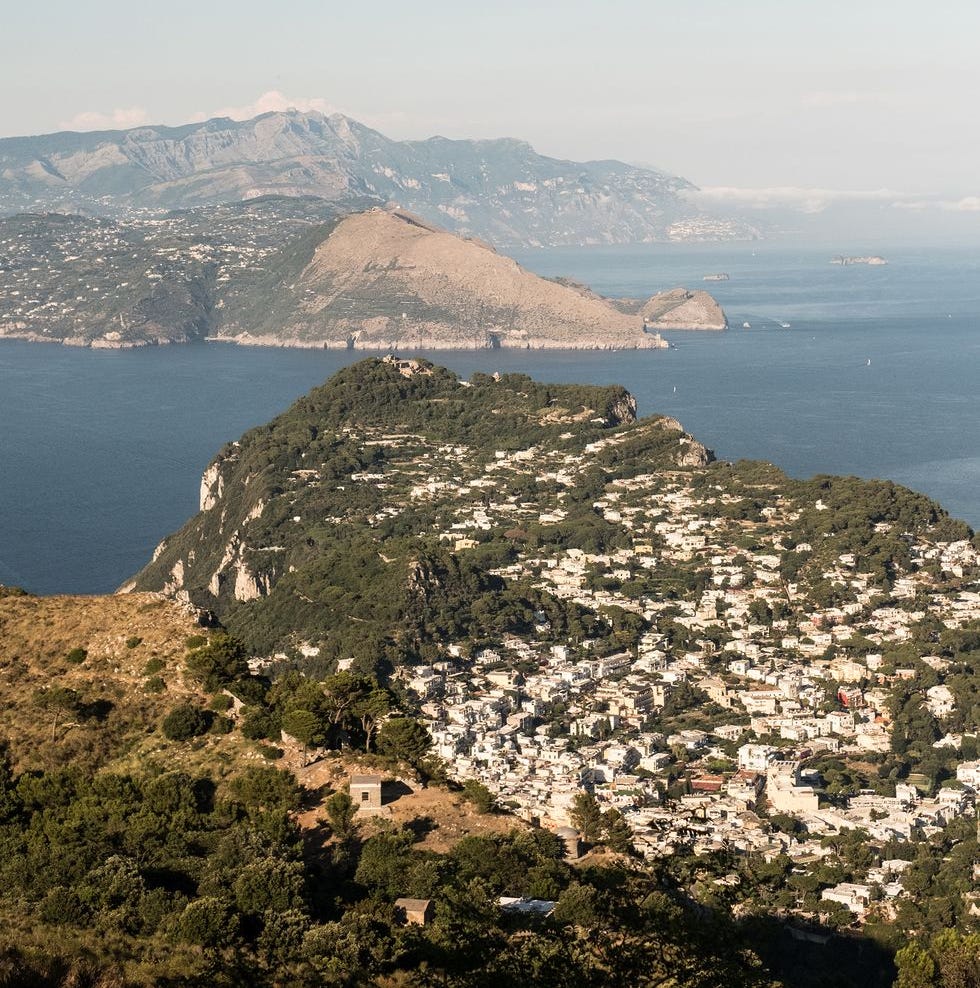 Sky, Mountainous landforms, Mountain, Sea, Coast, Hill, Promontory, Highland, Lake, Horizon, 