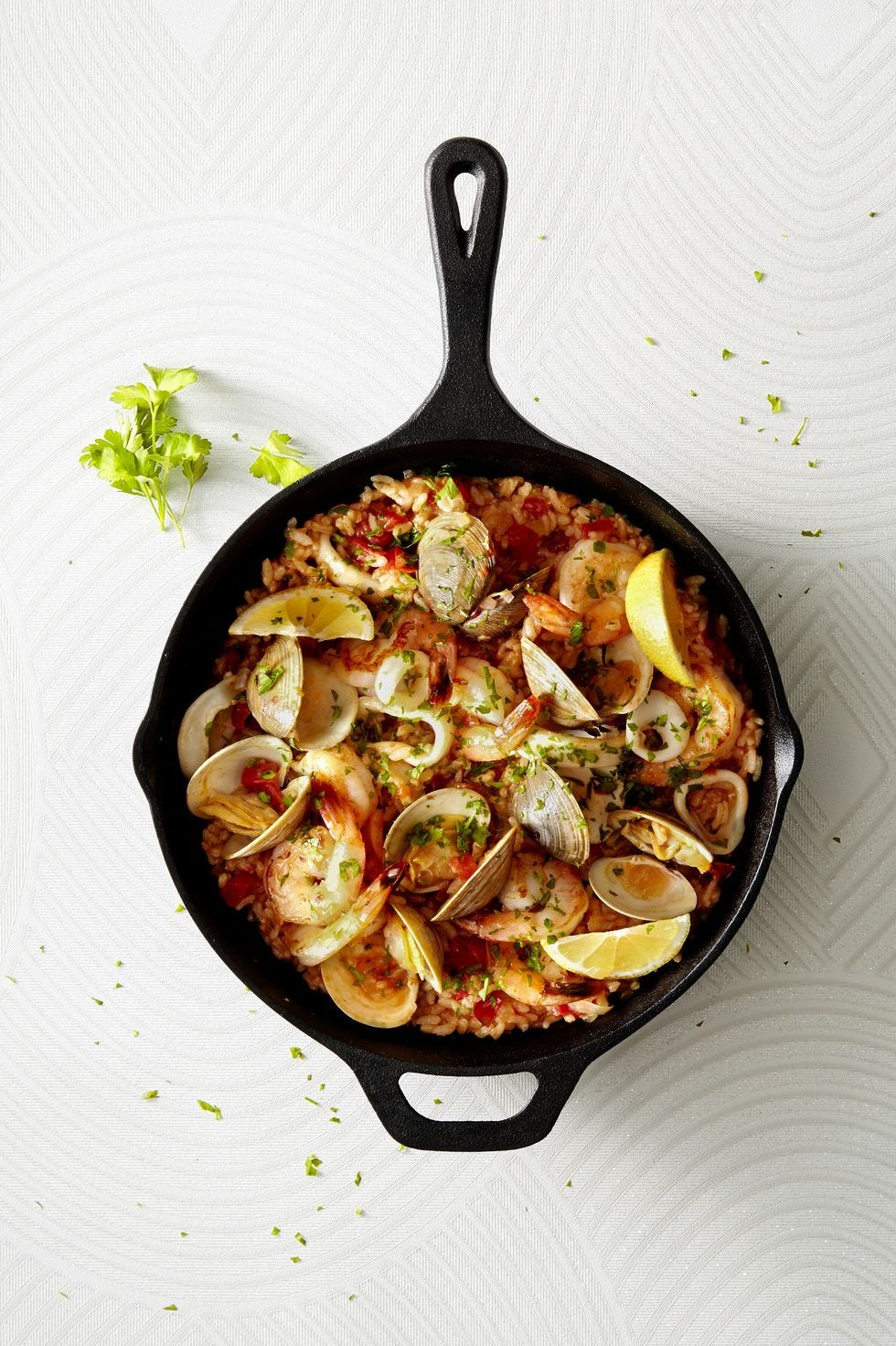 easy seafood paella in a black skillet