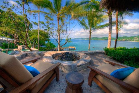Resort, Outdoor furniture, Arecales, Ocean, Tropics, Seaside resort, Caribbean, Outdoor table, Wood stain, Beach, 