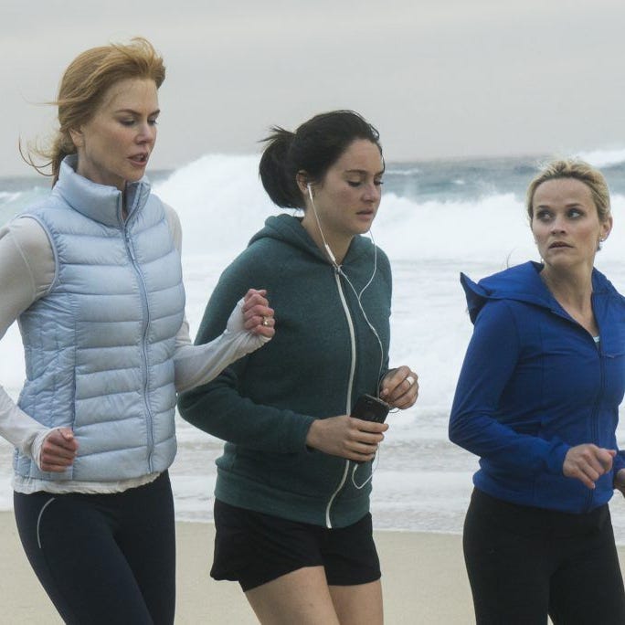three women jogging along a beach three women jogging along a beach