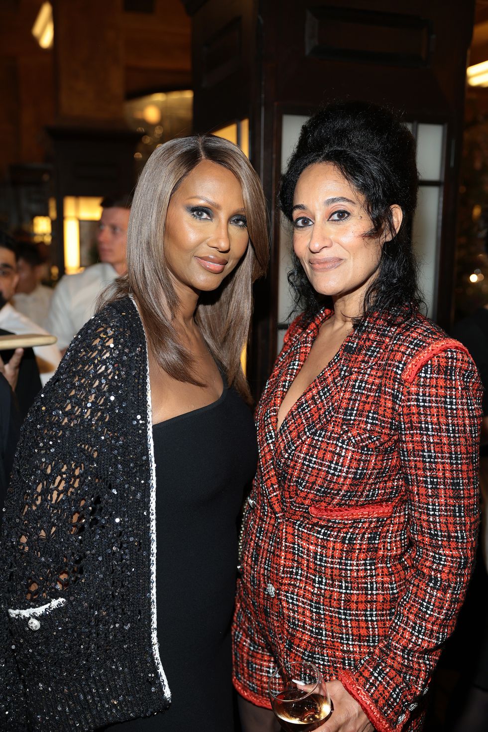 new york, new york june 12 l r iman and tracee ellis ross, wearing chanel, attend chanel tribeca festival artists dinner at balthazar on june 12, 2023 in new york city photo by dimitrios kambouriswireimage