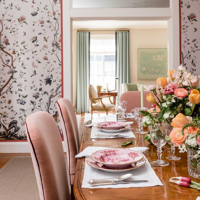 dining room, pink floral wallpaper, wooden oval table with pink velvet dining chairs
