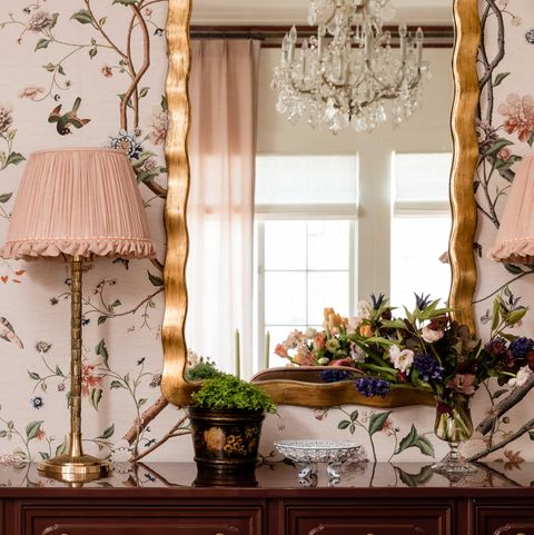 pink floral wallpaper, table lamp with a pink lamp shade