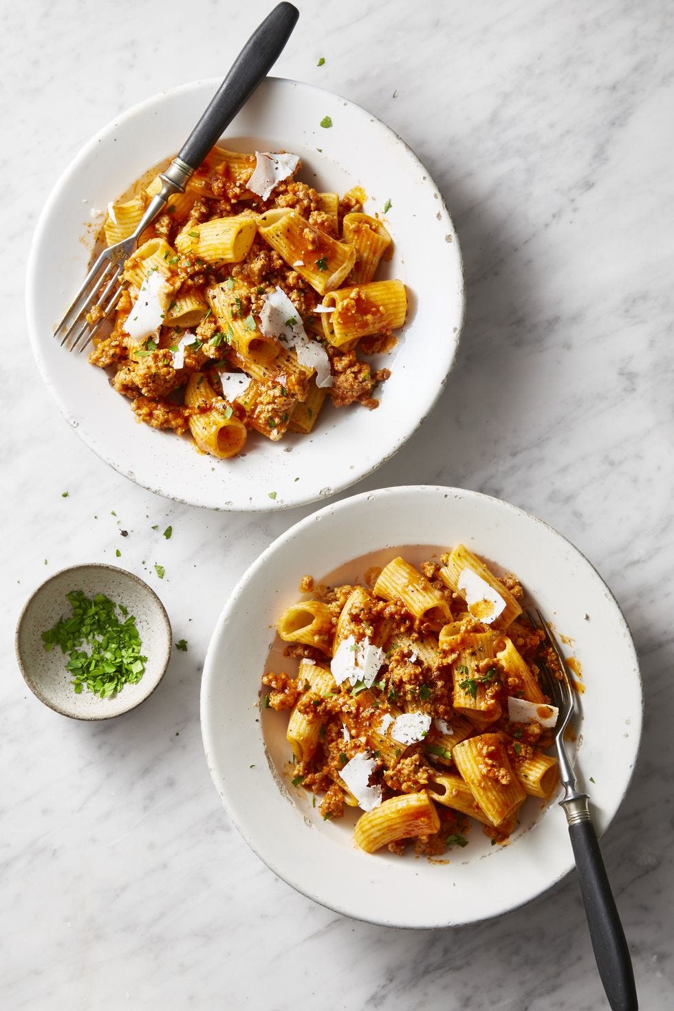 two bowls of pork ragu rigatoni