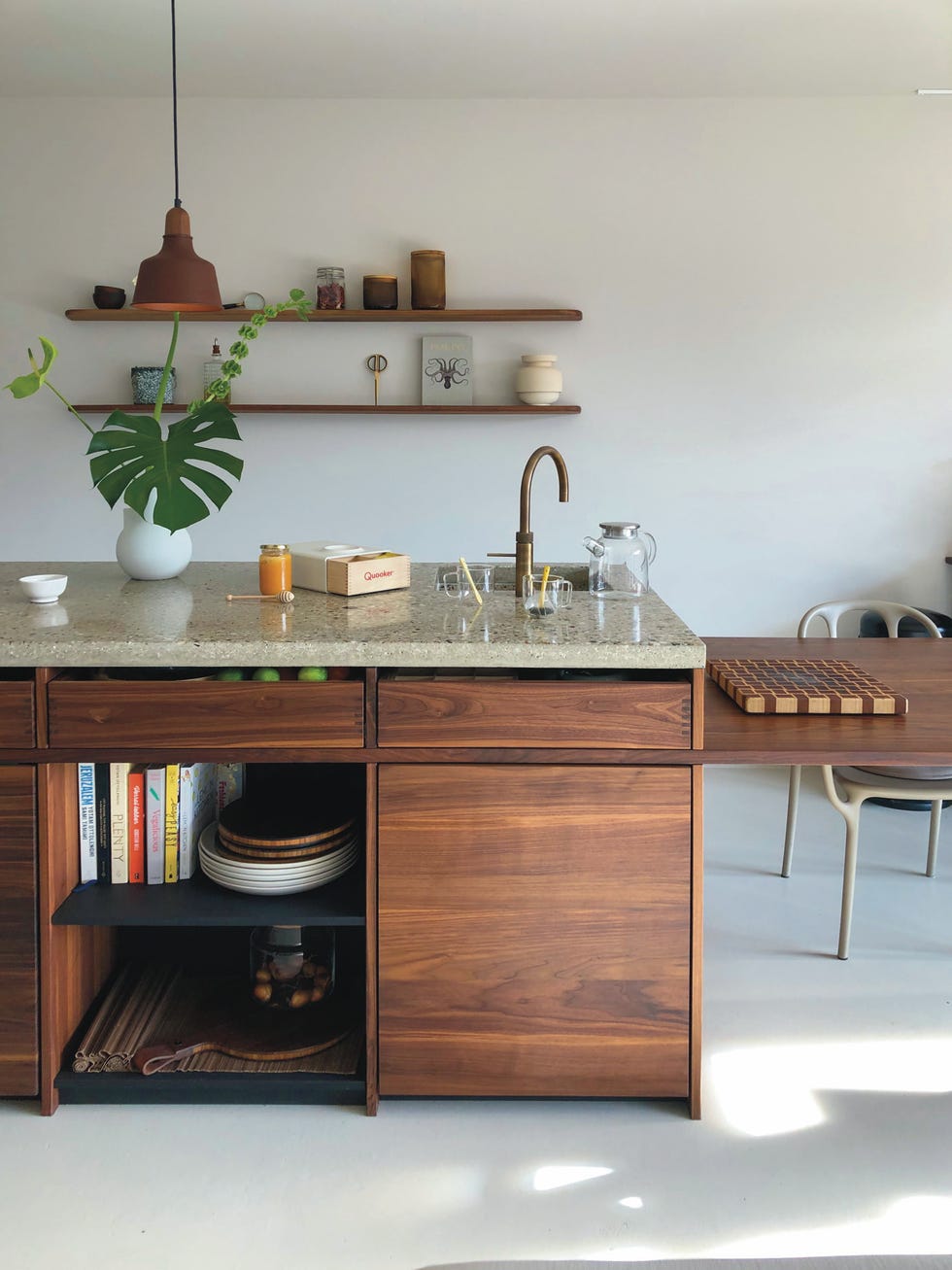modern kitchen with wooden cabinetry and granite countertop