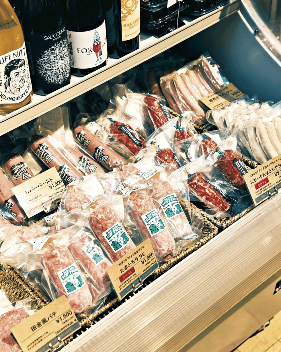 a shelf with food and bottles on it