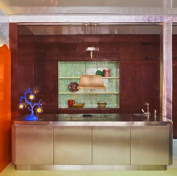 a kitchen with a large glass cabinet