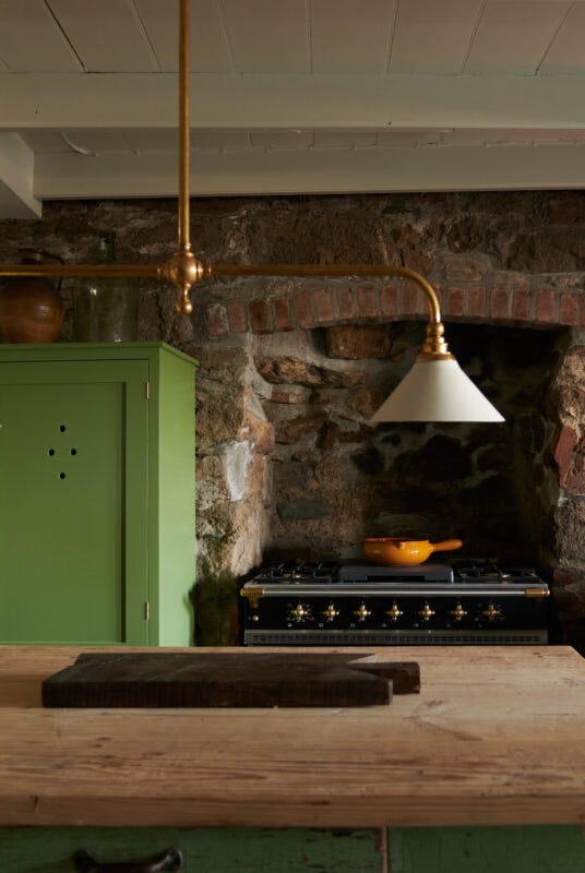 a cozy kitchen featuring rustic elements and warm lighting