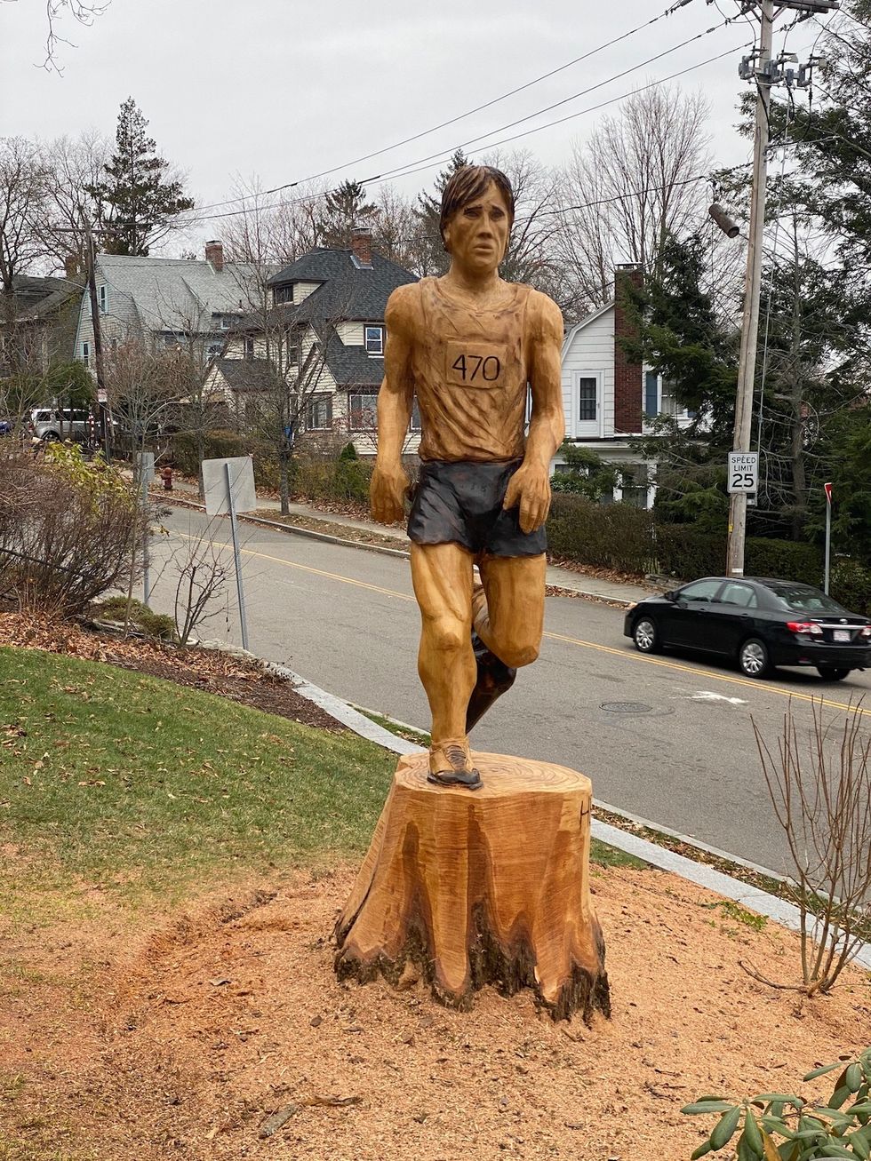 tree sculpture of a runner on the boston marathon course