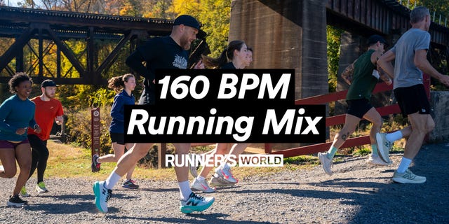 group of runners on a gravel path with a sign in the background