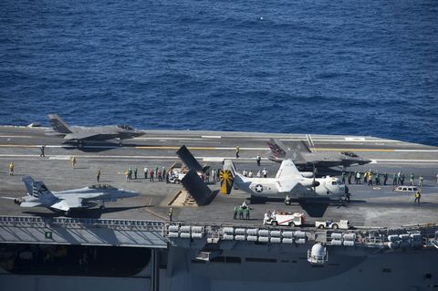 two f 35c lightning ii carrier variant joint strike fighters, an fa 18 super hornet and a c 2a greyhound conduct flight operations aboard the aircraft carrier uss nimitz cvn 68 the f 35 lightning ii pax river integrated test force from air test and evaluation squadron vx 23 is conducting initial at sea testing aboard nimitz us navy photo by mass communication specialist 2nd class antonio turretto ramosreleased