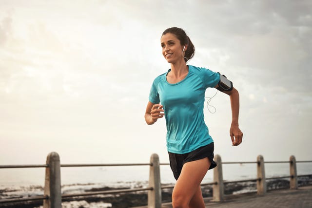 shot of a young woman running on the promenade