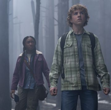 the stars of percy jackson and the olympians walking in a foggy forest